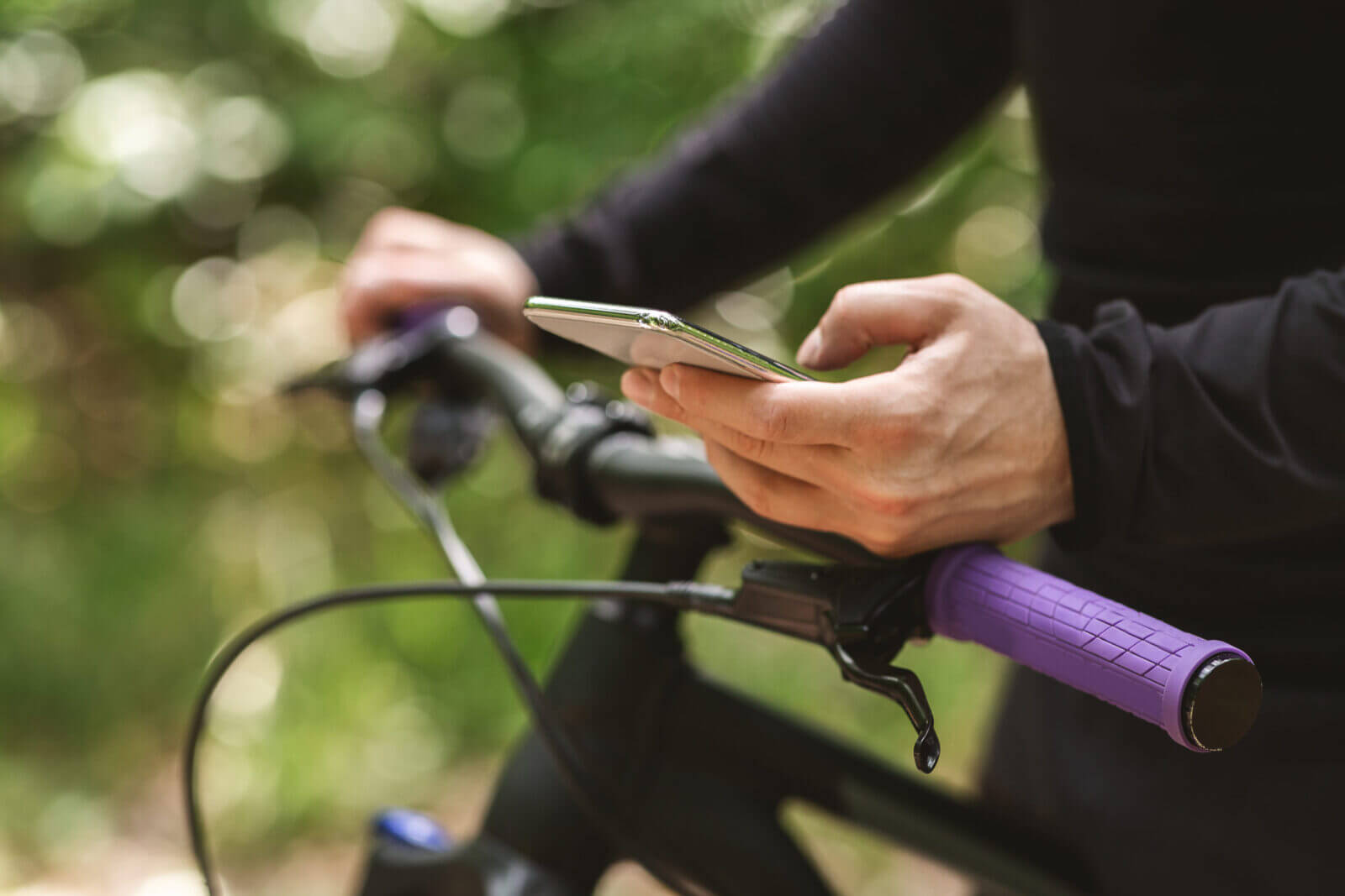 Cyclist holding a smartphone